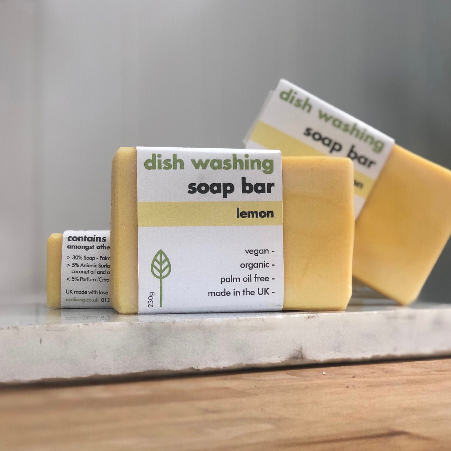 lemon yellow dish washing soap bar solid by eco living on shop counter, weigh and pay