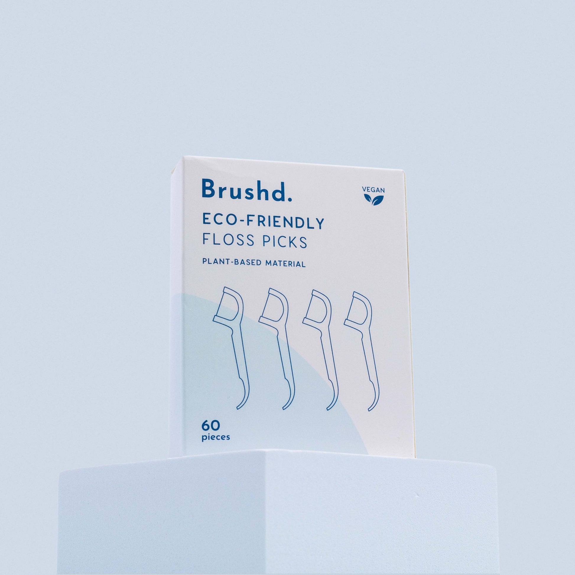 brushd eco friendly floss picks, blue background
