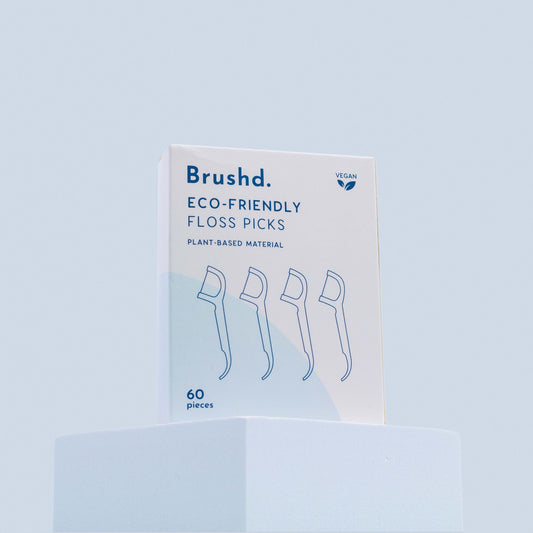 brushd eco friendly floss picks, blue background