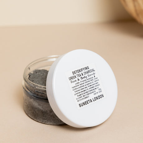 suneeta london's detoxifying charcoal and green tea face and body scrub. 120g pot