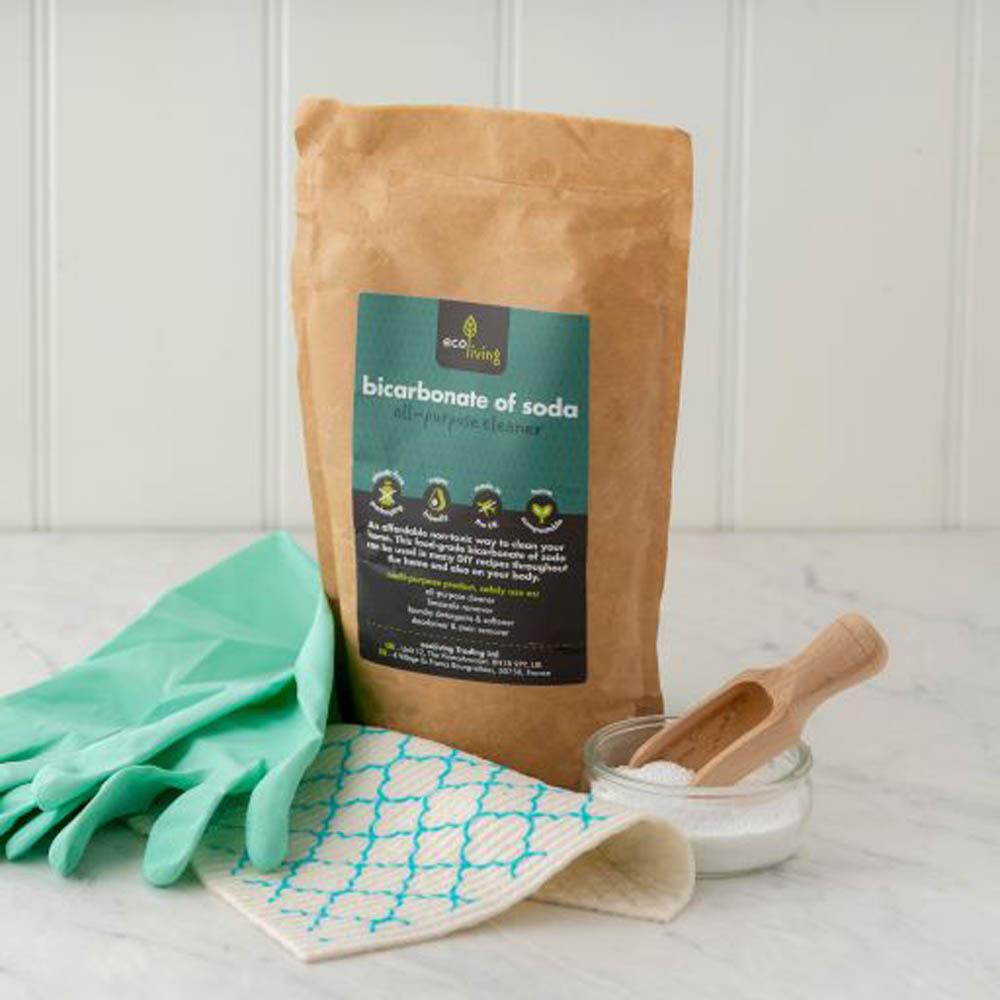 eco living bicarb of soda pictured alongside cleaning accessories 