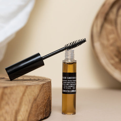 black castor oil serum for eyelashes lashes brows mascara tube by suneeta London x weigh and pay